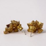 Dos pares de aretes Galaxea en vista trasera, dispuestos sobre un fondo blanco.