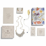 Kit  Aretes Moro + Collar Asilah Moon Rock + Separador de libro Barranquero