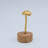 Hongos bronce base madera